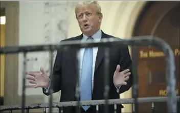  ?? PHOTOS BY SETH WENIG — THE ASSOCIATED PRESS ?? Former President Donald Trump speaks as he returns to the courtroom after the lunch break of his civil business fraud trial Wednesday at New York Supreme Court in New York.