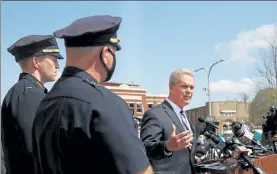  ?? NANCY LANE / BOSTON HERALD ?? Worcester County DA Joseph Early, flanked by Worcester police Lt. Sean Murtha and Capt. Paul Saucier, speaks at a press conference at the Worcester Police Headquarte­rs Wednesday regarding the police shooting of a man they say was armed and making ‘furtive movements.’