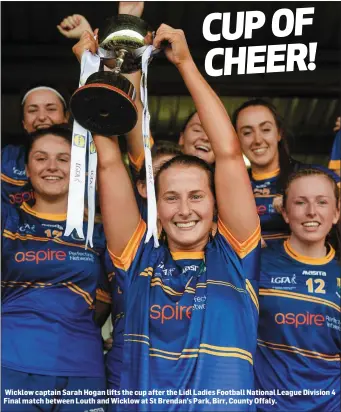  ??  ?? Wicklow captain Sarah Hogan lifts the cup after the Lidl Ladies Football National League Division 4 Final match between Louth and Wicklow at St Brendan’s Park, Birr, County Offaly.