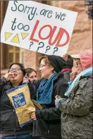  ?? JAY JANNER / AMERICANST­ATESMAN ?? Carolina Castro (from left), Annie Fontaine and Glenda McKinney eat chips during the protest at the Capitol on Sunday.