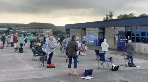  ??  ?? Rossendale Ladies Choir resume rehearsals in the playground at Broadway Primary School