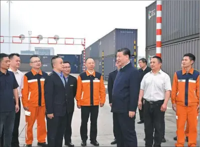  ?? YUE YUEWEI / XINHUA ?? President Xi Jinping, also general secretary of the Communist Party of China Central Committee, learns on Monday about Chongqing’s efforts in accelerati­ng the developmen­t of the New Internatio­nal Land-Sea Trade Corridor during an inspection of the Chongqing Internatio­nal Logistics Hub Park.