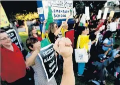  ?? Luis Sinco Los Angeles Times ?? PARENTS PROTEST Wednesday at Arminta Street Elementary in North Hollywood, where Celerity plans to open a charter school.