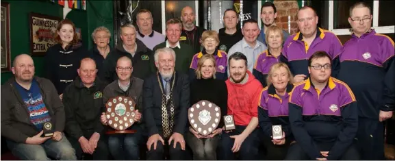  ??  ?? Mayor of Wexford Jim Moore, who presented the prizes, with all the winners of the St Patricks Day Parade awards on Sunday evening in Mackens The Cape bar.