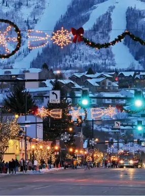  ??  ?? Opening image: Two of the author’s family waiting patiently for their mother as she checks out inside the tree fort.Clockwise from left: Steamboat’s historic Lincoln Avenue lit up for the holidays with the resort looming up behind, Riding through a grove of aspens at Del’s Triangle 3 Ranch; The lounge at One Steamboat Place; One of the gourmet dishes at Cloverdale Restaurant.