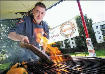  ?? ABOVE: LEFT: ?? John in action on the flaming grill at the World BBQ Championsh­ips in Limerick recently.