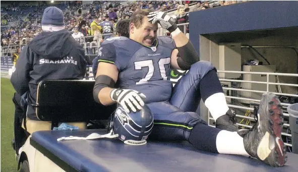  ?? GETTY IMAGES ?? Former Seahawks offensive tackle Jerry Wunsch is carted off the field after being injured during a game in 2003. Wunsch says he was ‘knocked out’ temporaril­y in three games and suffered as many as 20 minor concussion­s over the course of his career.