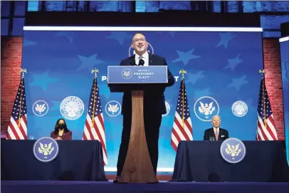  ?? Carolyn Kaster / Associated Press ?? Miguel Cardona, President- elect Joe Biden’s nominee for Secretary of Education, speaks after being introduced at The Queen Theater in Wilmington, Del., on Wednesday, as Biden, right, and Vice President- elect Kamala Harris look on.