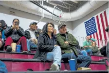  ?? The New York Times Co. Christie Hemm Klok, © ?? Ernest J. Whitehorse, right, attends a basketball game at Page High School in Page, Ariz., in January. “What is next?” asked Whitehorse, who started working at the town’s power plant when he was 18. “I don’t know the answer for this town.”