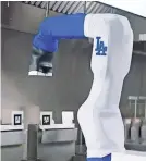  ?? COURTESY OF THE LA DODGERS ?? White Castle plans to deploy the robot Flippy to reduce human contact with food amid the coronaviru­s pandemic.