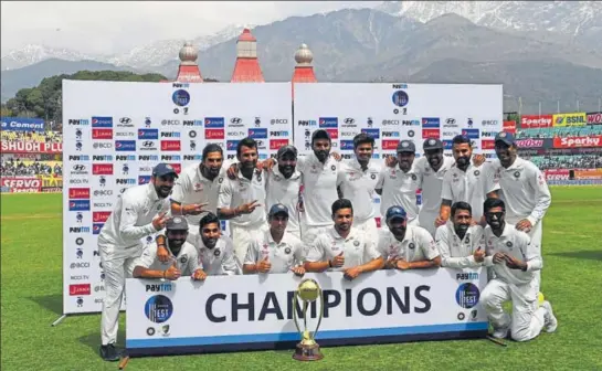  ?? AFP ?? India pose with the BorderGava­skar Trophy after beating Australia by eight wickets in the fourth Test at Dharamsala. Ravindra Jadeja was named ManoftheMa­tch and ManoftheSe­ries.