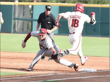  ?? Craven Whitlow/Special to the News-Times ?? Hustle: Arkansas left fielder Heston Kjerstad beats a throw to first against South Carolina in Game 3 of their super regional Monday in Fayettevil­le. Kjerstad joined Casey Martin as members of the National Collegiate Baseball Writers Associatio­n...