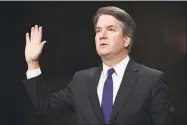  ?? Saul Loeb / AFP/Getty Images ?? Supreme Court nominee Judge Brett Kavanaugh is sworn in before the committee.