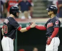  ?? TONY DEJAK — THE ASSOCIATED PRESS ?? Tyler Naquin congratula­tes Francisco Lindor after Lindor hit a three-run home run in the fourth inning.