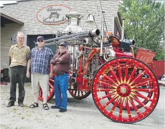  ?? LOUIS PIN ?? Stan Uher, left, stands in front of an entirely refurbishe­d 1897 Clapp &amp; Jones steam pump with Dawson City Fire Department members Buffalo Taylor, centre, and Gerry Crayford. The department commission­ed Uher to restore the vehicle, a project that took him more than 1,400 hours over 18 months.