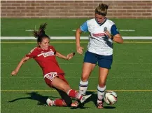  ?? STAFF PHOTO BY ANGELA LEWIS FOSTER ?? Atlanta’s Jocelyn Baker goes down as she and Chattanoog­a Football Club’s Mara Deluca battle for control of the ball during Thursday’s match at Finley Stadium.