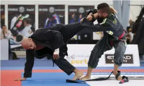  ??  ?? Araujo, left, won the black belt in Al Ain coming from a rib injury as he steps up preparatio­n for Abu Dhabi World Pro