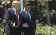  ?? Jim Watson / AFP / Getty Images ?? President Trump discusses trade and North Korea last week with Chinese President Xi Jinping.