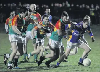  ??  ?? Eugene Dunne is chased by a posse of Carlow defenders in Bray.