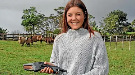  ??  ?? Designer Nicole Austin with her Moray lamb docking tool.