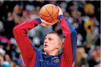  ?? JACK DEMPSEY/THE ASSOCIATED PRESS ?? Denver Nuggets center Nikola Jokic warms up Saturday prior to Game 1 of a first-round playoff game against the Los Angeles Lakers in Denver. Jokic has a shot at his third MVP award.