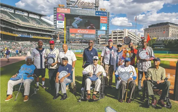  ?? DAVE REGINEK / GETTY IMAGES FILES ?? The stats of these former Negro Leagues players, honoured before a Detroit Tigers game in August 2019, will now be recognized by MLB. Negro Leagues Baseball Museum
President Bob Kendrick says the decision is “about atonement” and respect for the leagues and players, respect that is long overdue in the United States.