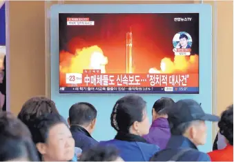  ?? AHN YOUNG-JOON/ASSOCIATED PRESS ?? People watch file footage of North Korea’s missile launch during a news program at the Seoul Railway Station in Seoul, South Korea, on Saturday.