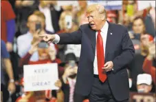  ?? Tony Dejak / Associated Press ?? President Donald Trump acknowledg­es his supporters after speaking at a campaign rally on Monday in Cleveland.