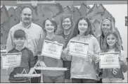  ?? Floyd County Schools ?? Winners of the “Best Looking Bridge” portion of the popsicle stick bridge competitio­n pose with their winning popsicle bridges at Armuchee Elementary on Thursday.