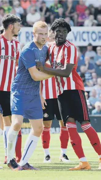  ??  ?? Josh Maja gets hands on with Hartlepool United’s Conor Newton.