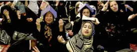  ?? AP ?? NIGHT OF DESTINY Muslim women place copies of the Quran on their heads to mark Laylat al-Qadr, or the “Night of Destiny.” Muslims believe the Quran was first revealed to the Prophet Muhammad.—