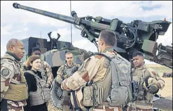  ?? AFP ?? French defence minister Florence Parly (2nd L) talks to French soldiers engaged in the Operation Chammal, which is part of the Operation Inherent Resolve, the internatio­nal coalition against the Islamic State near Al-qaim, a few kilometres away from the last scrap of territory held by IS in east Syria.