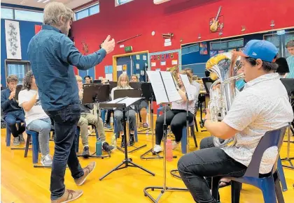  ?? Photos / Supplied ?? NZSO principal trombonist David Bremner leading a youth brass workshop hosted by Te Awamutu Brass.