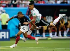  ?? ASSOCIATED PRESS ?? FRANCE’S KYLIAN MBAPPE (LEFT) is fouled by Argentina’s Marcos Rojo, drawing a penalty, during a round of 16 World Cup match at the Kazan Arena in Kazan, Russia, Saturday.
