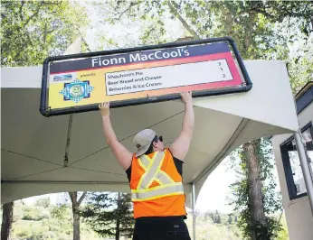  ?? KAYLE NEIS ?? Dakota Olson helps set up this year’s Taste of Saskatchew­an at Kiwanis Park on Sunday. The festival by the river celebratin­g the best local restaurant­s have to offer is in its 23rd year and begins Tuesday.