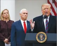  ?? AP/MANUEL BALCE CENETA ?? Speaking Friday in the Rose Garden, President Donald Trump floated the idea of an emergency declaratio­n to build a border wall, but said “we’re giving [negotiatio­ns] a shot.” Secretary of Homeland Security Kirstjen Nielsen and Vice President Mike Pence listen.