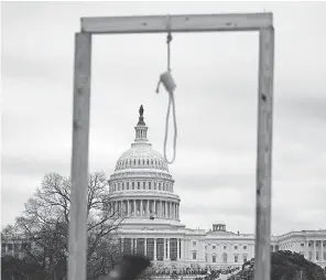  ?? ANDREW CABALLERO- REYNOLDS/ AFP VIA GETTY IMAGES ?? A makeshift gallows was set up as supporters of President Donald Trump gathered on the west side of the U. S. Capitol on Jan. 6. Trump’s supporters, angry about the presidenti­al election, stormed a session of Congress that had convened to certify Joe Biden’s victory. Some of the rioters called for Vice President Mike Pence to be hanged.