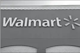  ?? [SWAYNE B. HALL/THE ASSOCIATED PRESS] ?? Walmart is testing a service that lets a delivery person walk into a customer’s home when they’re not there to drop off packages or put groceries in the fridge. The retailer says the service is for busy families who don’t have time to stop at a store.