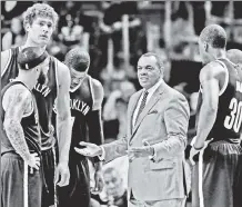  ?? AP ?? WHAT’S GOING ON? Nets coach Lionel Hollins talks to his team during Wednesday’s 104-98 loss in Miami.