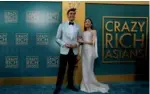  ?? MARIO ANZUONI / REUTERS ?? Cast members Henry Golding and Constance Wu pose at the premiere for Crazy Rich Asians in Los Angeles in August.
