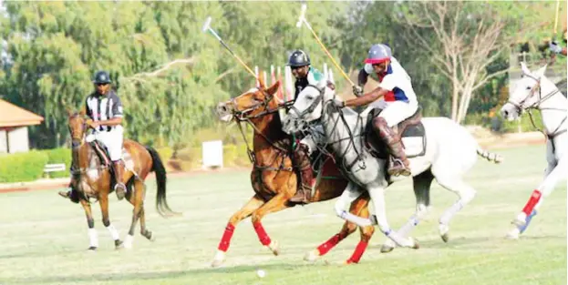 ??  ?? Nigeria’s top rated Bello Buba (second from left) check-mates his opponents at a recent polo tournament in Kaduna. Buba and other top polo players are waiting on Zaria Polo Club to showcase their skills in Zauzau Kingdom this year.