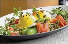  ?? Duc Hoang ?? Cold smoked salmon with poached eggs and asparagus is on the new weekend brunch menu at Navy Blue in Rice Village.