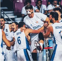  ?? (FIBA Europe website) ?? ISRAEL PLAYERS celebrate yesterday after advancing to the under-20 European Championsh­ip final in Crete, Greece.