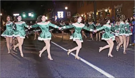  ?? CHRIS BARBER — DIGITAL FIRST MEDIA ?? The dancers from Longwood Performing Arts did a Rockettes-like show at the beginning of the festivitie­s for the Kennett Square Holiday Light Parade on Friday evening.