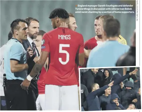  ??  ?? 1 England manager Gareth Southgate and defender Tyrone Mings in discussion with referee Ivan Bebek amid racist chanting by a section of home supporters.