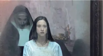 ?? COS AELENEI ?? Taissa Farmiga (right) plays a novitiate trying to learn the truth about a demonic nun's (Bonnie Aarons) role in some dark goings-on in "The Nun."