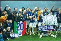  ?? ?? Inter Milan players celebrate at the end of the Serie A soccer match between AC Milan and Inter Milan at the San Siro stadium in Milan, Italy. (AP)