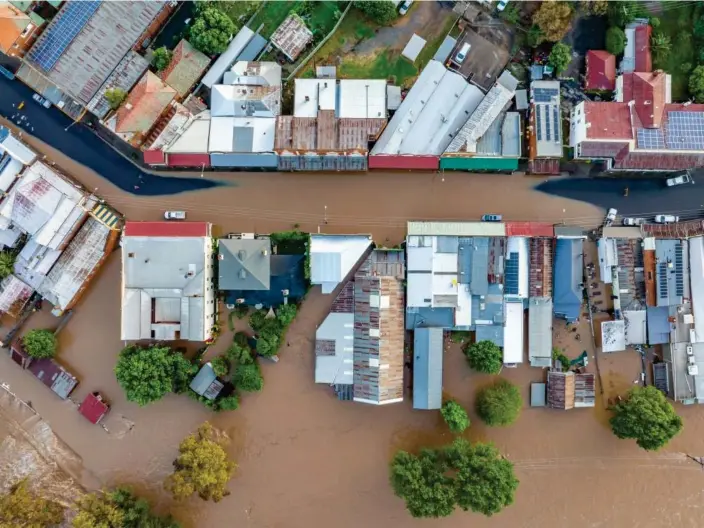  ?? Photograph: Chris Watson Farmpix Photograph­y ?? Aerial image of the flooded town of Canowindra on Monday. Eugowra is 30km north-west in NSW.