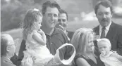  ??  ?? Phil Mickelson and his family enjoy the ceremonies on the 18th green after he won the Greater Hartford Open on the final hole in 2002.