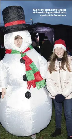  ??  ?? Ella Keane and Ellie O’Flanagan at the switching on of the Christmas lights in Greystones.